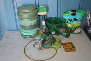 lot 17 image: Gardening Lot Peat Pellets, Water Valve Hole Covers, Melnor Sprinkler Timer, 14 Cutting Chain, Hand Spreader, Perlite