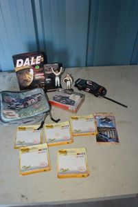 lot 24 image: Dale Earnhardt Lot DVD Movie, Figurines, Post it Notes, Lunch Box