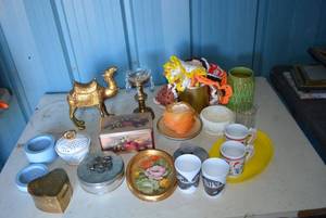 lot 27 image: Home Dcor Lot Mugs, Candles, Crocheted Coasters, Golden Camel and Trinket Boxes
