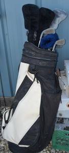 lot 57 image: Golf Club Set Dunlop Club Set, Club Covers and Black and White Leather Bag