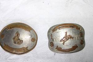 lot 86 image: Two Rodeo belt buckles both say German Silver