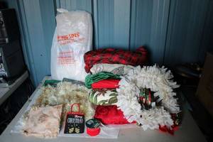 lot 89 image: Christmas Lot Decorations and more Vinyl and Cloth Tablecloths, Tinsel Garland