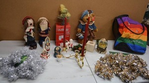 lot 118 image: Misc. Christmas Decorations Holiday Treasures Bear, Tinsel Garland, Puerto Vallarta Bag, Candle Holders, Caroling Figurines, Snowman in the Frig Box