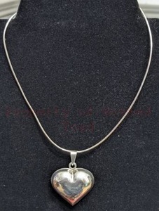 lot 9 image: Sterling Silver Heart and Chain. Heart is about 1.5 long by 1.5 wide. Chain is 16 long.