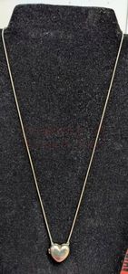 lot 11 image: Sterling Silver Heart and Chain. Hear  is about 34 tall and a little over 12 wide. Chain is 21 long.