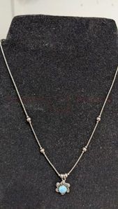 lot 12 image: Sterling Silver Pendant and Chain.