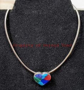 lot 16 image: Sterling Silver Heart and Chain. Heart has a multicolor like stone about 1 tall. Chain is 16.25 long.