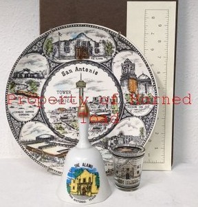 lot 64 image: One Alamo Bell , one Alamo Shot Glass, and a Decorative San Antonio Plate a little over 9 in diameter