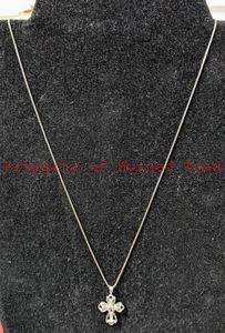 lot 14 image: Sterling Silver Cross and Chain. Chain is 19.5 long.