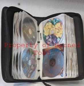 lot 44 image: CDs Carrying Case with a lot of CDs inside.