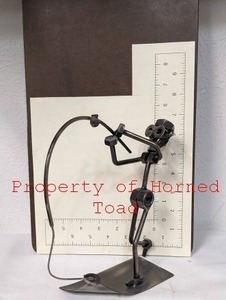 lot 78 image: Metal Art Nuts-and-Bolts Fisherman 8 Tall