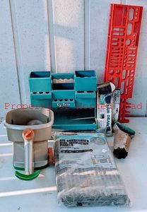 lot 118 image: Various Garage Items Fertilizer Spreader Rain Drain, Grass Plug Tool and more.