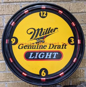 lot 96 image: Man Cave Clock Miller Genuine Draft Uses one AA Battery and Electricity