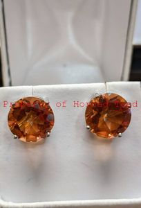 lot 144 image: Firey Azotic Topaz Gemstones 12mm, approx.12CTW Set in Platinum over Sterling Silver.