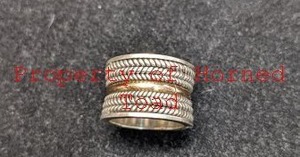 lot 153 image: Sterling Silver Ring Sz 7 15mm wide with a gold center ring accent