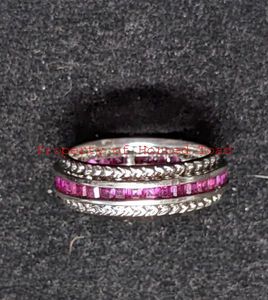 lot 154 image: Silver Tone Ring Sz 10 with red stones