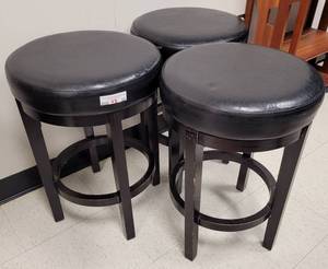 lot 20 image: (3) BLACK 24-INCH CAMERON BARSTOOLS AS SHOWN. EACH APPROX. 24 H x 17 DIA. SOLD 3 X THE MONEY