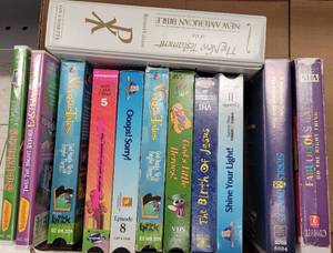 lot 204 image: ASSORTED DVD AND VHS MOVIES AS SHOWN.