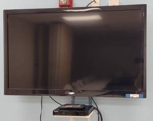 lot 214 image: (1) SANYO 50 TV MODEL FVM5082 WITH REMOTE AND (1) SAMSUNG BLU-RAY DISC PLAYER MODEL BD-H5100 WITH REMOTE AS SHOWN. BUYER IS RESPONSIBLE FOR PROPER REMOVAL