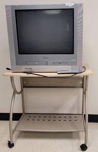 lot 236 image: (1) ROLLING MEDIA DESK AND (1) TOSHIBA 24 TVDVDVCR COMBINATION MODEL MW24FN1 AS SHOWN.