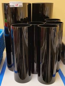 lot 304 image: (8) TALL BLACK GLASS VASES IN STYLE SHOWN. (3) 5.75 DIA x 15.25 H AND (5) 4 DIA x 11.75 H. SOLD 8 X THE MONEY