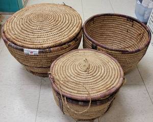 lot 315 image: (3) LARGE WOOVEN RATTAN STYLE BASKETS AS SHOWN. RANGE IN SIZE FROM 12.75 W x 10 H TO 17 W x 11.5 H. TWO HAVE LIDS. SOLD 3 X THE MONEY