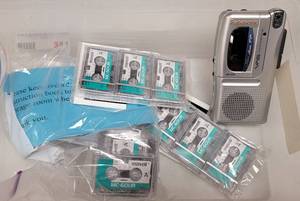lot 384 image: PANASONIC RN-305 HANDHELD MICRO CASSETTE VOICE RECORDER WITH VOICE ACTIVATION SYSTEM AND EXTRA MICRO CASSETTES AS SHOWN.