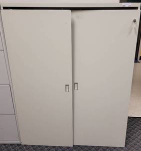 lot 284 image: METAL CABINET WITH DETACHED DOORS AS SHOWN. APPROX. 42 W x 15 D x 53 H.
