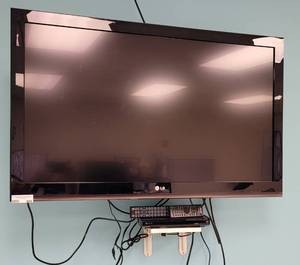 lot 409 image: (1) LG 1080P TV MODEL 42LK450 WITH REMOTE AND (1) SONY CD  DVD PLAYER MODEL DVP-SR510H WITH REMOTE AS SHOWN. BUYER IS RESPONSIBLE FOR PROPER REMOVAL