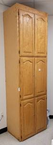 lot 415 image: TALL WOODEN STORAGE CABINET IN STYLE SHOWN.
