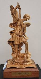 lot 3 image: HAND MADE OLIVE WOOD ST. MICHAEL FIGURE AS SHOWN. INTRICATE CARVED WOOD DESIGN. MADE IN BETHLEHEM - HOLY LAND. APPROX. 7 W x 14.75 H x 5.5 D.