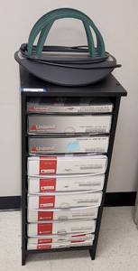 lot 424 image: UNIBIND S225 THERMAL BINDING MACHINE WITH AN ASSORTMENT OF SUPPLIES AND CABINET AS SHOWN. CABINET APPROX. 14.75 W x 37 H x 17.75 D. CHECK IT OUT