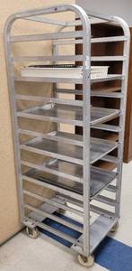 lot 431 image: COMMERCIAL STAINLESS STEEL END LOAD BUN  SHEET PAN RACK WITH 4 FULL SHEET PANS AND MORE AS SHOWN. APPROX. 21 W x 67.5 H x 26.5 D.