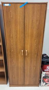 lot 433 image: DOUBLE DOOR WOODEN STORAGE CABINET IN STYLE SHOWN. APPROX. 29 W x 72 H x 15 D.