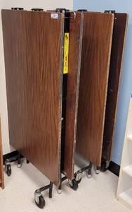 lot 436 image: (2) LARGE CAFETERIA STYLE FOLDING TABLES WITH WHEELS AS SHOWN. EACH APPROX. 94.75 L x 29.25 W x 28.75 H. SOLD 2 X THE MONEY