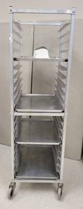 lot 439 image: COMMERCIAL STAINLESS STEEL END LOAD 20 BUN  SHEET PAN RACK WITH 4 FULL SHEET PANS AND MORE AS SHOWN. APPROX. 21 W x 70 H x 26 D.