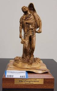 lot 445 image: HAND MADE OLIVE WOOD THE FORGIVENESS FIGURE AS SHOWN. INTRICATE CARVED WOOD DESIGN. MADE IN BETHLEHEM - HOLY LAND. APPROX. 7 W x 12.25 H x 7 D.
