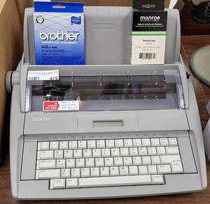 lot 475 image: BROTHER ELECTRONIC TYPEWRITER MODEL SX-4000 WITH SUPPLIES AS SHOWN.