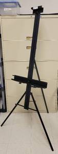 lot 516 image: BLACK ALUMINUM EASEL AS SHOWN. APPROX. 35 W x 66 H x 29 D.