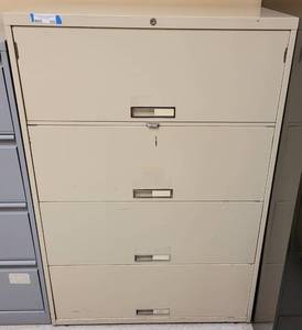 lot 555 image: 4-DRAWER METAL LATERAL FILING CABINET AS SHOWN. APPROX. 36 W x 18 D x 52.5 H.