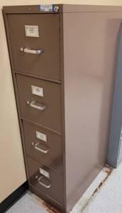 lot 556 image: 4-DRAWER METAL FILE CABINET AS SHOWN. APPROX. 15 W x 25 D x 52.25 H.