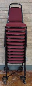 lot 607 image: (12) FABRIC UPHOLSTERED STACK CHAIRS IN STYLE AND COLOR SHOWN. CART NOT INCLUDED SOLD 12 X THE MONEY