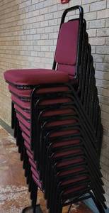 lot 611 image: (12) FABRIC UPHOLSTERED STACK CHAIRS IN STYLE AND COLOR SHOWN. CART NOT INCLUDED SOLD 12 X THE MONEY