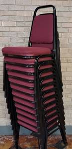 lot 615 image: (12) FABRIC UPHOLSTERED STACK CHAIRS IN STYLE AND COLOR SHOWN. CART NOT INCLUDED SOLD 12 X THE MONEY