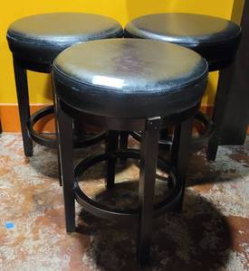 lot 623 image: (3) BLACK 24-INCH CAMERON BARSTOOLS AS SHOWN. EACH APPROX. 24 H x 17 DIA. SOLD 3 X THE MONEY