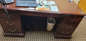 lot 629 image: WOODEN OFFICE DESK IN STYLE SHOWN. CONTENTS NOT INCLUDED APPROX. 66.5 W x 30.5 H x 30.5 D.