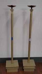lot 651 image: (2) TALL CANDLE HOLDERS WITH WOODEN SQUARED BASE IN STYLE SHOWN. APPROX. 12 W x 60 H x 12 D. SOLD 2 X THE MONEY
