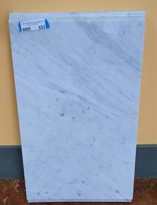 lot 653 image: MARBLE TOP FOR A VANITY  END TABLE AS SHOWN. APPROX. 25.25 W x 2.25 H x 14.5 D.