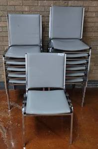 lot 660 image: (12) STACKABLE VINYL UPHOLSTERED GRAY CHAIRS WITH CHROME FRAME AS SHOWN. SOLD 12 X THE MONEY