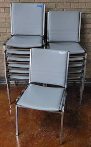 lot 662 image: (12) STACKABLE VINYL UPHOLSTERED GRAY CHAIRS WITH CHROME FRAME AS SHOWN. SOLD 12 X THE MONEY